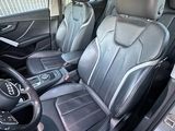 the interior of a car with black leather seats and a steering wheel