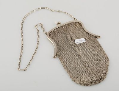 an antique silver mesh purse with chain strap and clasp