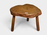 a small wooden table with a small wooden base
