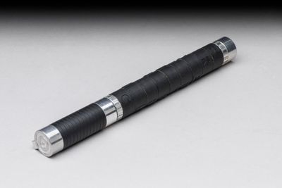 an image of a black pen with a silver tip sitting on a white surface