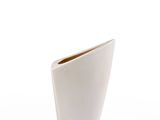 a white vase that is sitting on a table