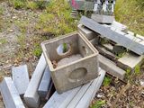 a pile of concrete blocks sitting on the ground