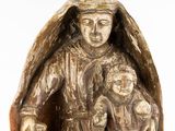 a statue of a woman holding a child and a sheep