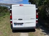 a white van that is parked on the side of the road