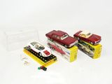 three toy cars that are sitting on top of each other
