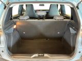 the back of a car with the trunk open and the seats down
