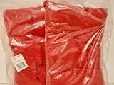 two bags of watermelon sitting on a table
