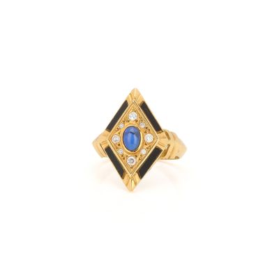 an image of a gold ring with a blue stone and diamonds