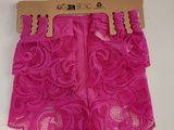 pink lace shorts with a wooden hanger on a white background