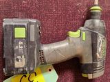 a cordless drill and a cordless nailer on a red carpet