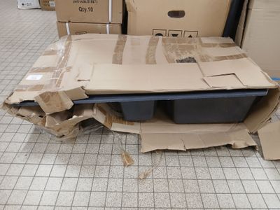 a pile of boxes that are sitting on the floor