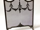 an image of a fireplace screen with a decorative design on it