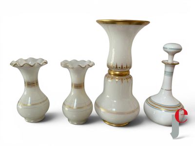 four vases sitting next to each other on a white surface