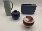 four different types of vases on the table