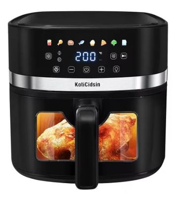 une photo d'une friteuse à air chaud noire contenant un poulet