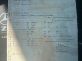 a picture of a mercedes receipt on a car