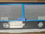 a picture of a window that has two clocks on it