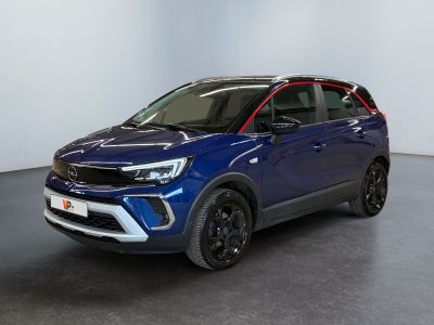 a blue suv parked in a room with a black floor