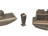 pair of antique silver plated metal items on a white background
