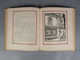 an open book with a picture of a castle on it
