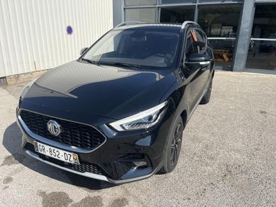 a black car parked in front of a building
