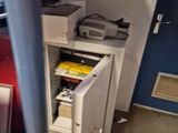 an image of a small safe box under a stair