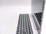 a laptop computer sitting on top of a white table