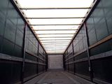 an image of a long hallway with a skylight above it