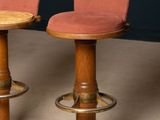pair of mid century bar stools with pink velvet upholstered seats