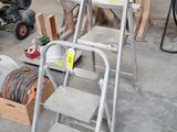 a ladder that is sitting in the middle of a room