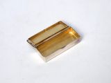 an image of a small metal box on a white surface