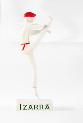 a figurine of a man with a baseball bat in his hand
