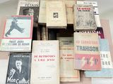 a lot of old books on a table together