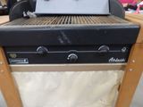 an image of a grill with a grill top on it