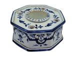a blue and white octagonal box with a flower design on it