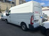 a white van that is parked on the side of the road