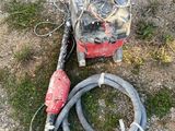 a fire hydrant and a hose laying on the ground