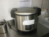 a stainless steel pot on a counter with a paper towel in front of it