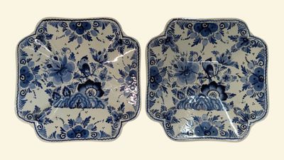 pair of blue and white plates with floral designs on them