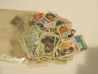a bag full of stamps sitting on top of a table