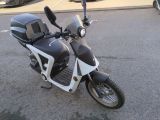 a black and white motorcycle parked in a parking lot