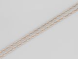 a close up of two silver chains on a white surface