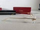 a pair of glasses sitting on a table next to a pair of glasses