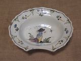a small bowl with a picture of a girl on it