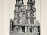 an old picture of a large building with a clock on it