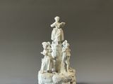 porcelain figurine of a statue of a woman and children