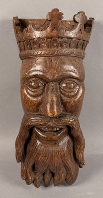an image of a wooden statue of a man with a crown on his head