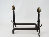 pair of antique brass candlesticks on cast iron stand