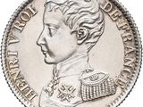 a close up of a silver coin with a woman ' s face