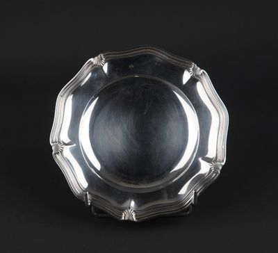 a silver plate on a black background with a black background